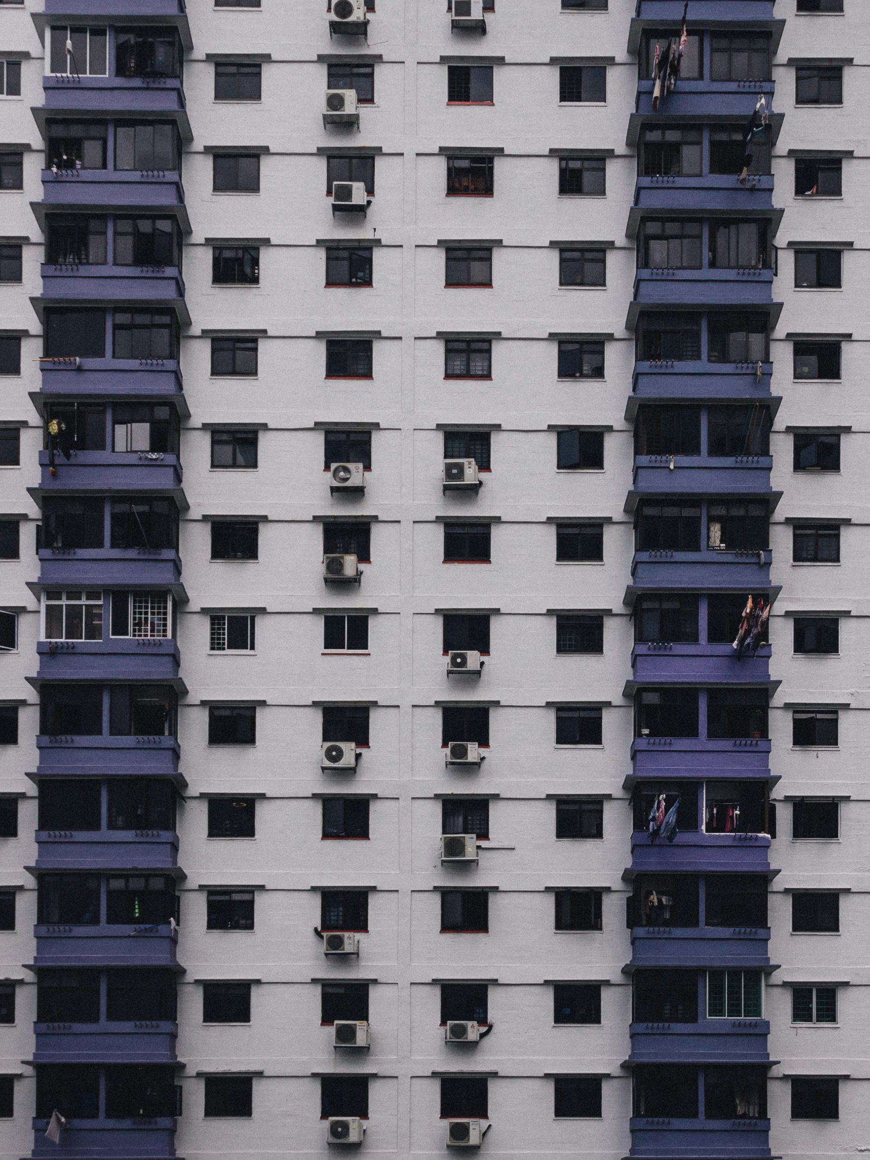 white and purple concrete high-rise building view during daytime